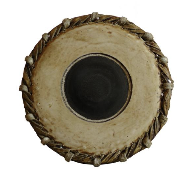The valanthalai, the smaller treble head of a real mridangam